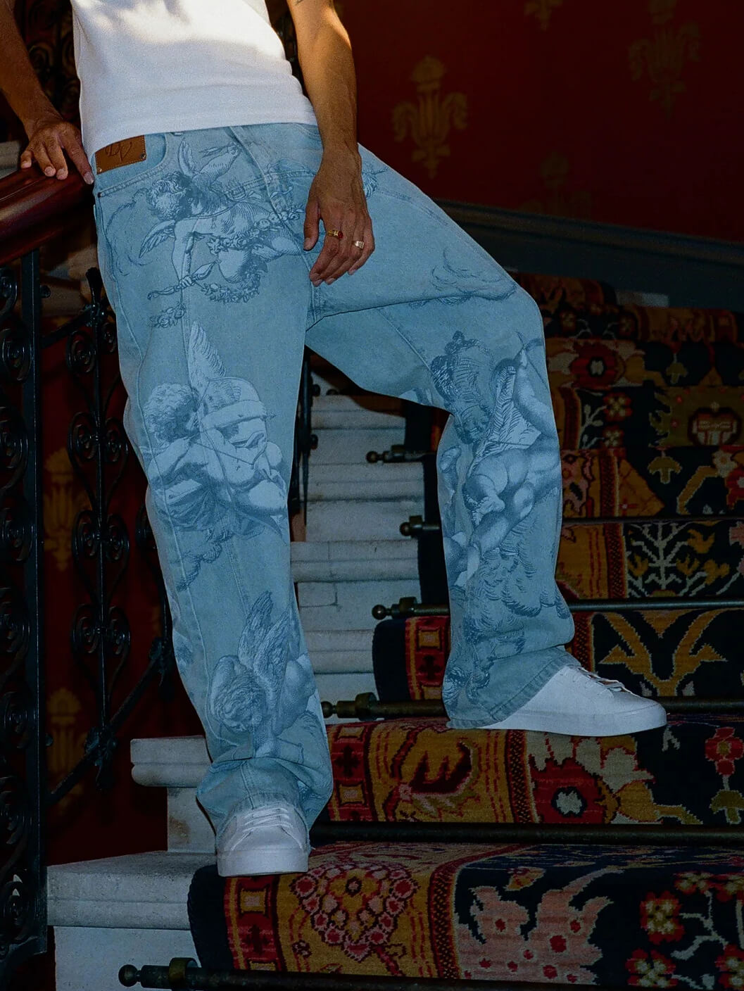 Cupid print faded blue jeans