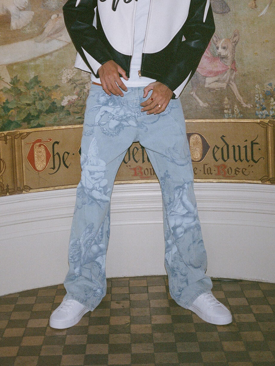 Cupid print faded blue jeans